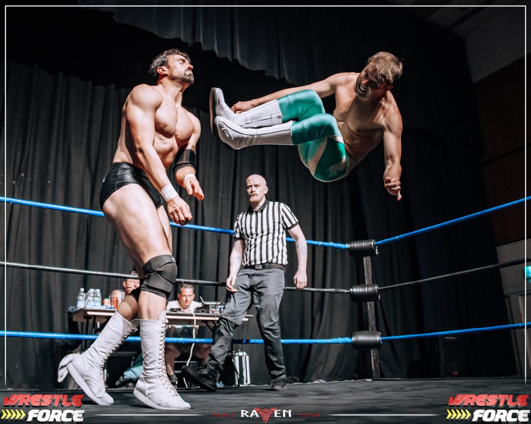 Photo of Two Wrestlers in the Wrestling Ring