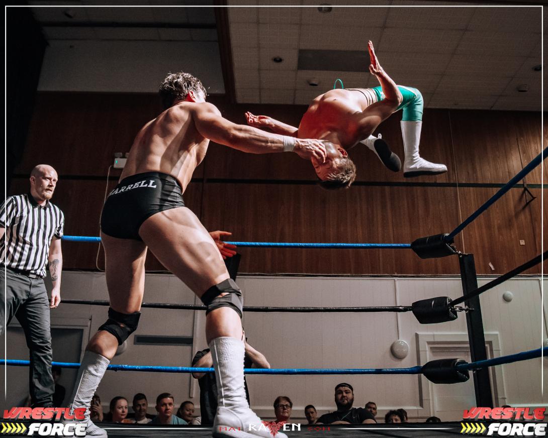 Photo of Two Wrestlers in the Wrestling Ring