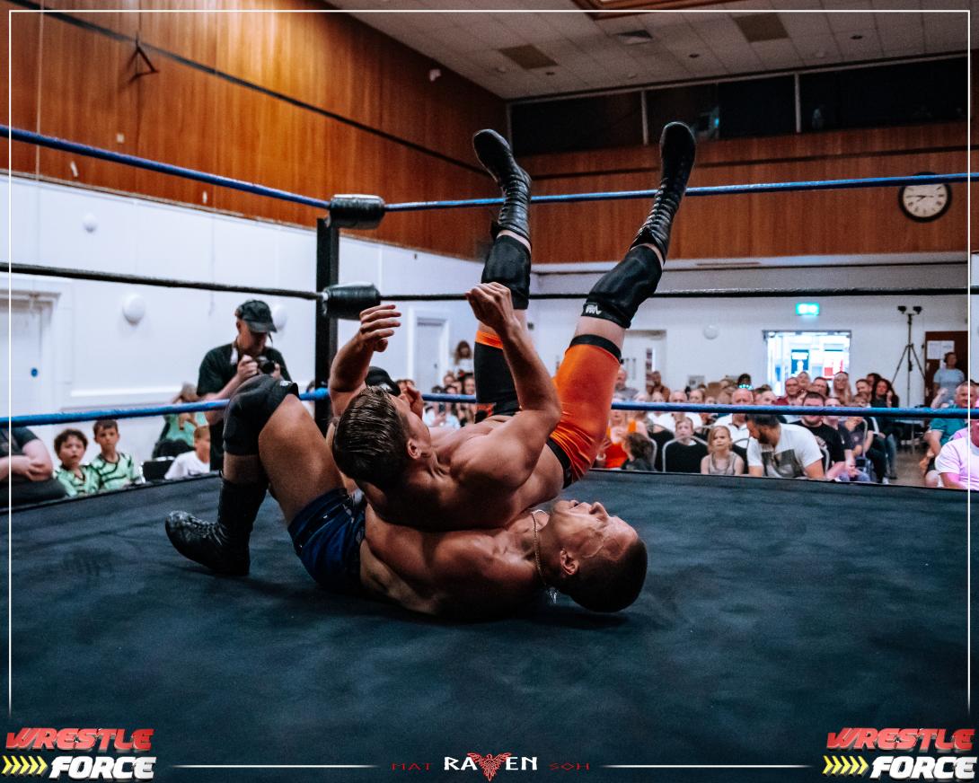 Photo of Two Wrestlers in the Wrestling Ring